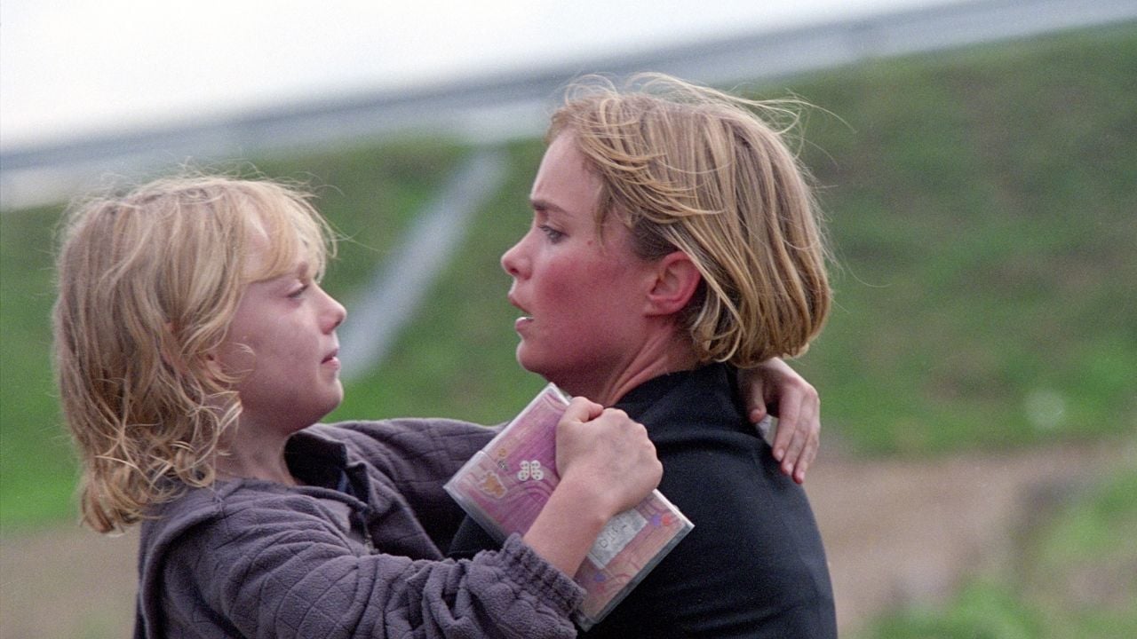 Dakota Fanning y Radha Mitchell en Hombre en llamas.