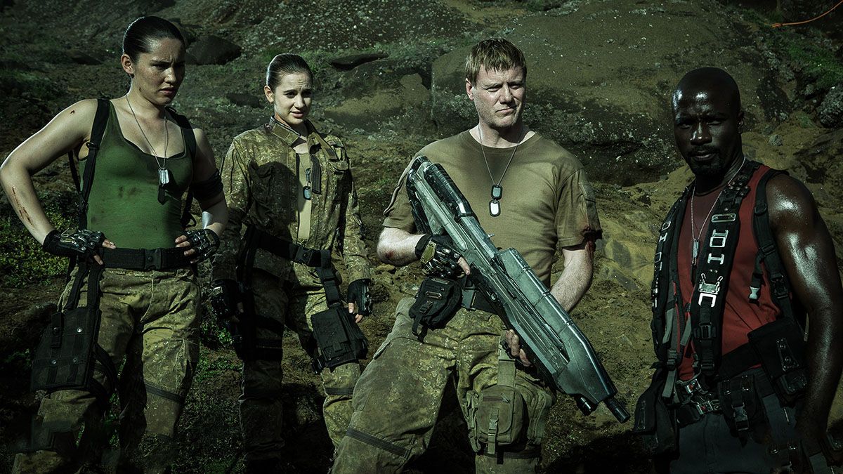 Foto Christina Chong, Steven Waddington, Mike Colter